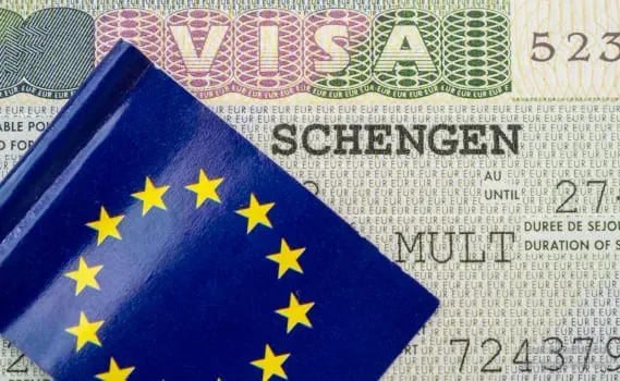A Schengen short-stay visa sticker in a passport