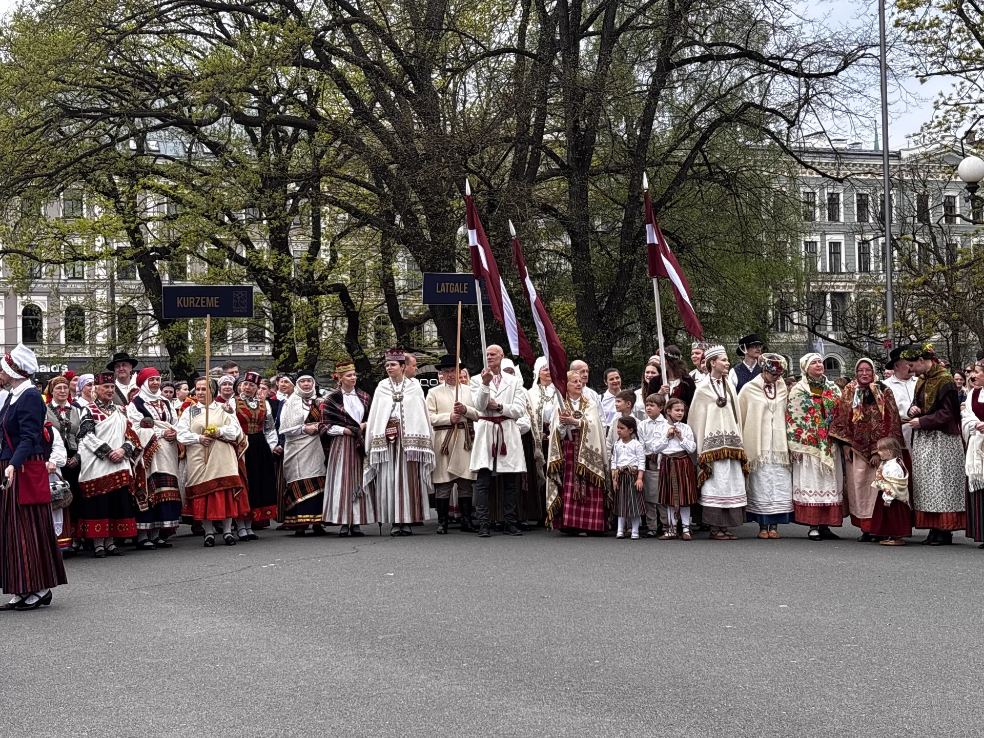 Latvian folk group with flags in central Riga
